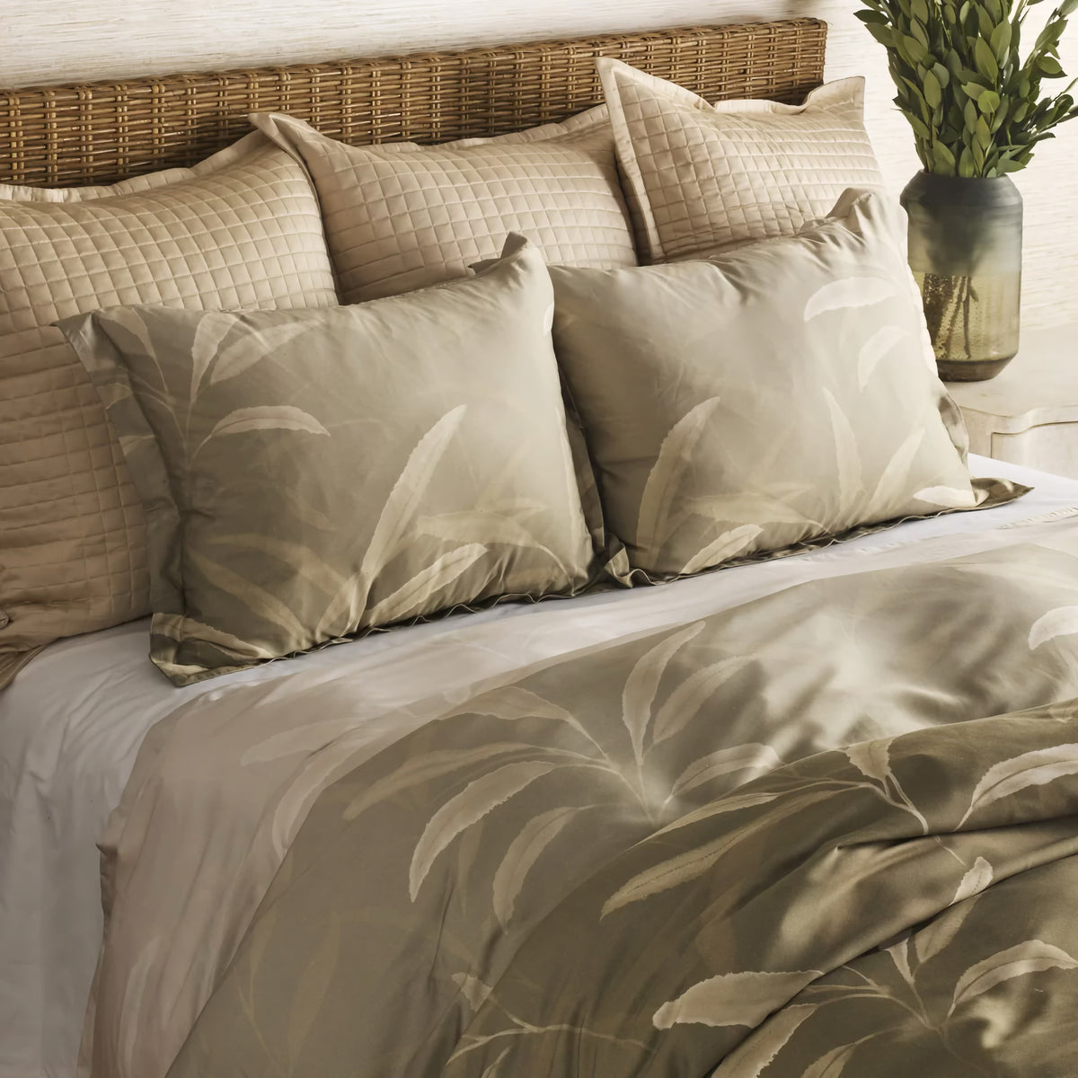 Side view of Sage-colored Ann Gish Willow Duvet Set with bedding coordinate