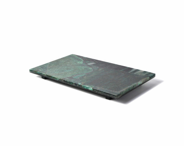 A rectangular green aventurine bath accessory slab with small feet, placed on a white surface with a shadow.