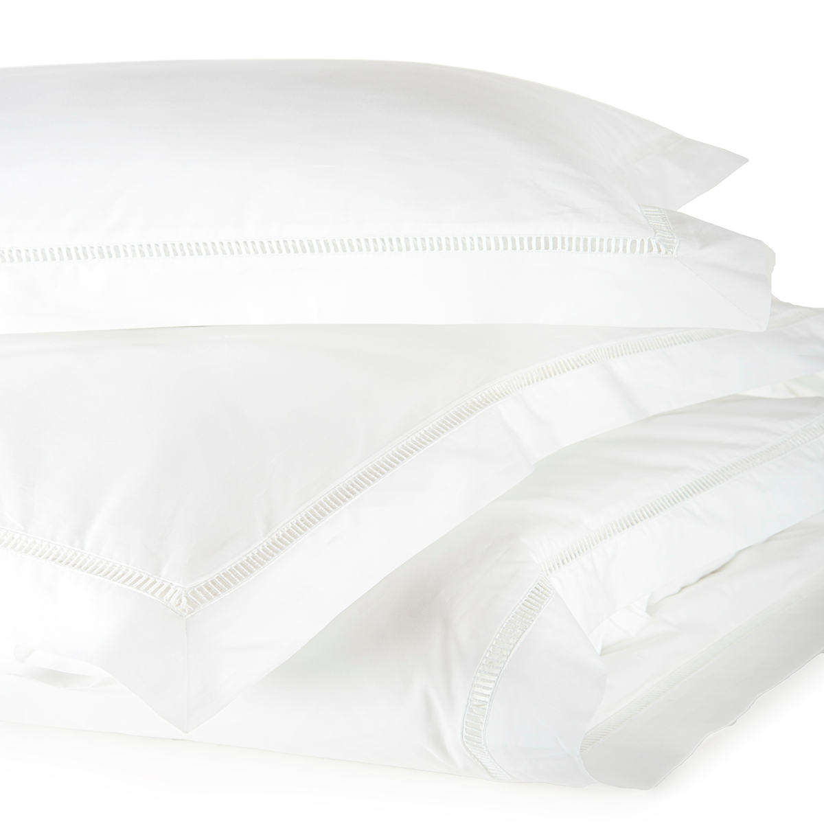 Closeup of White on White Stack of BOVI Escada Shams and Pillowcase