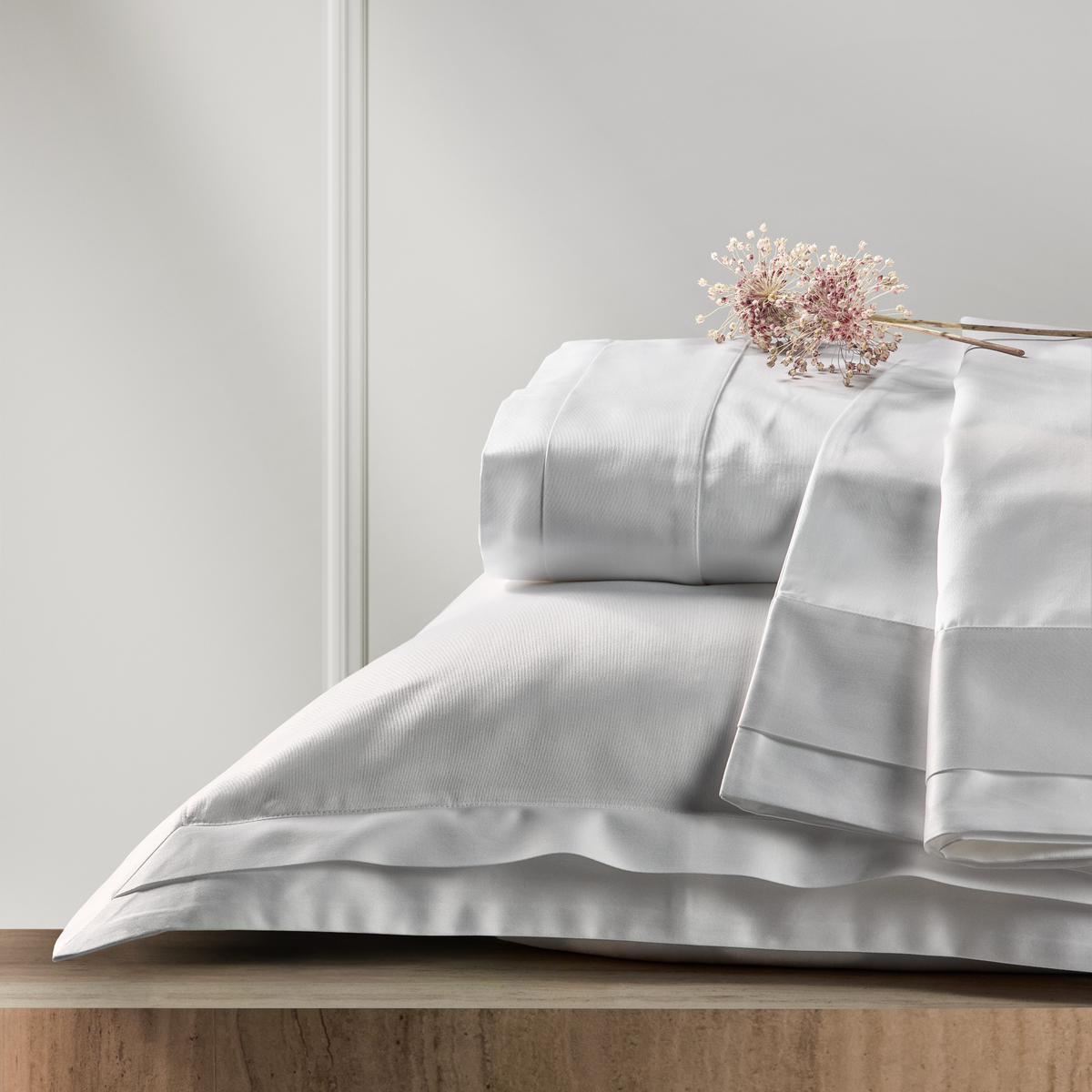 Stack of White BOVI Luxor Bedding