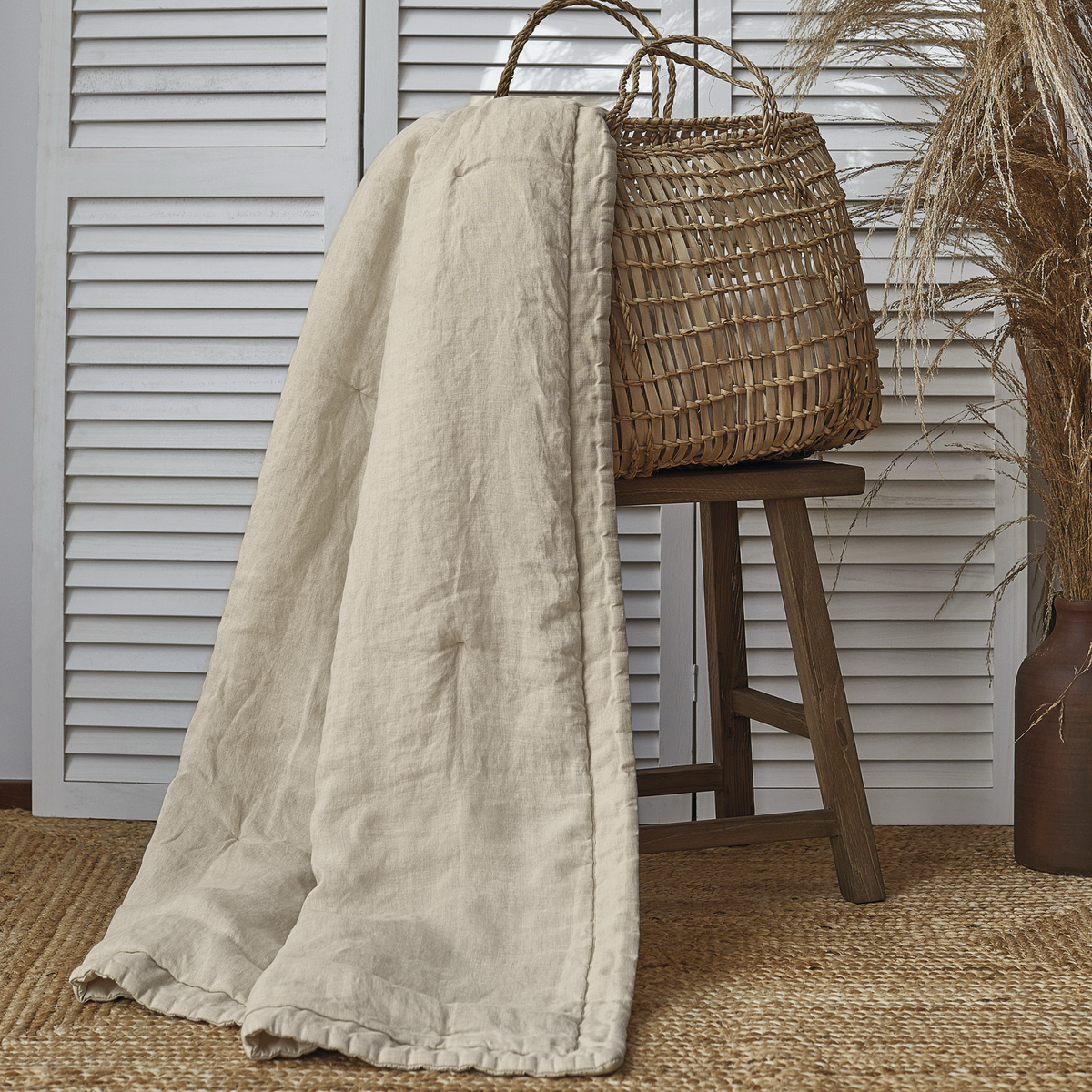 Flax BOVI Madeira Coverlet Hanging from a basket