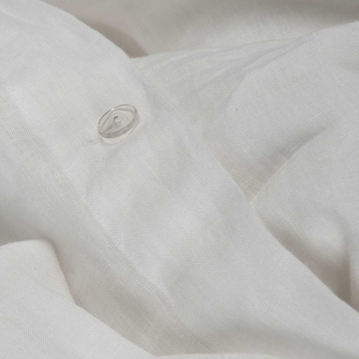 Fabric Closeup of BOVI Marbella Bedding in White and Flax colors