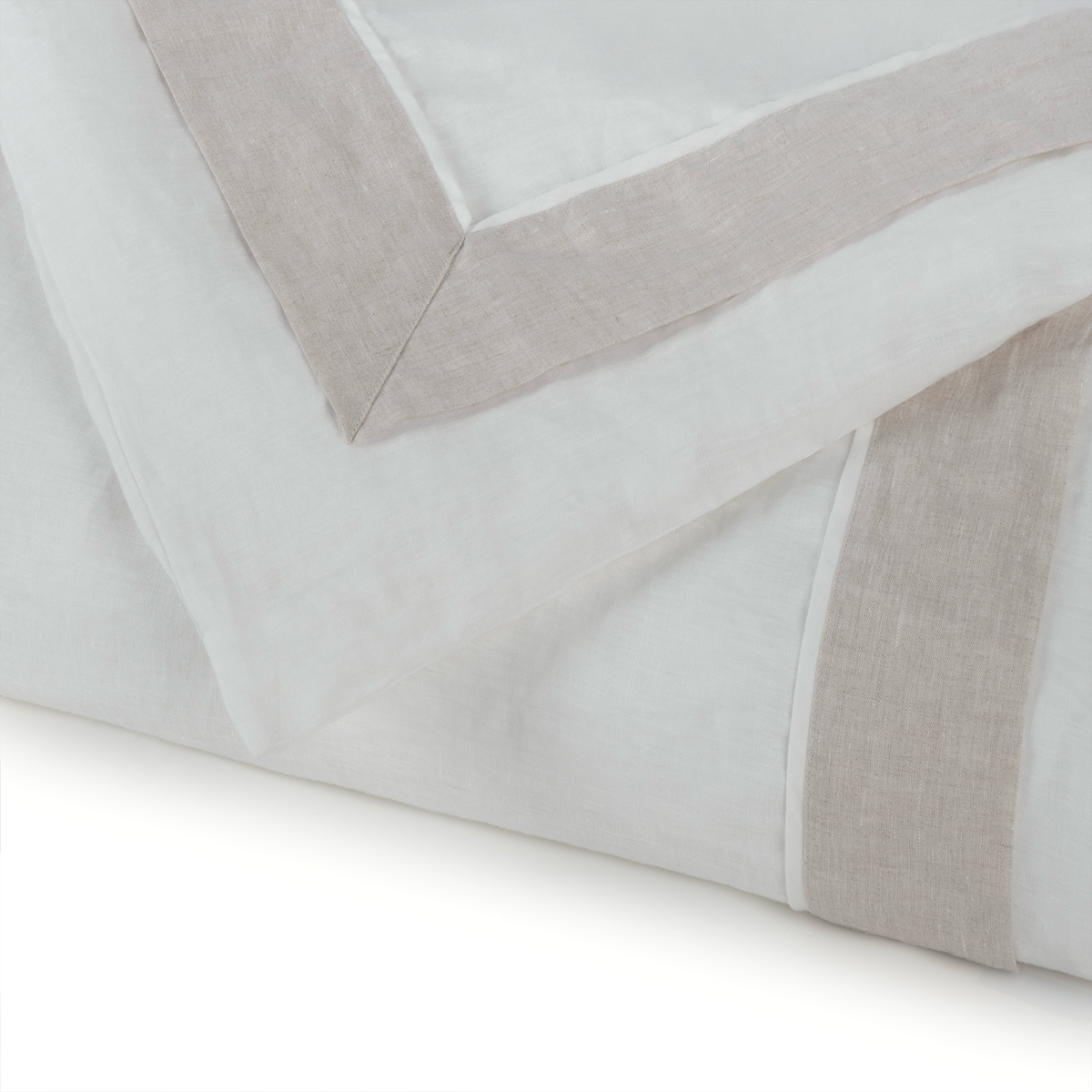 Folded Pattern of BOVI Marbella Bedding in White and Flax colors