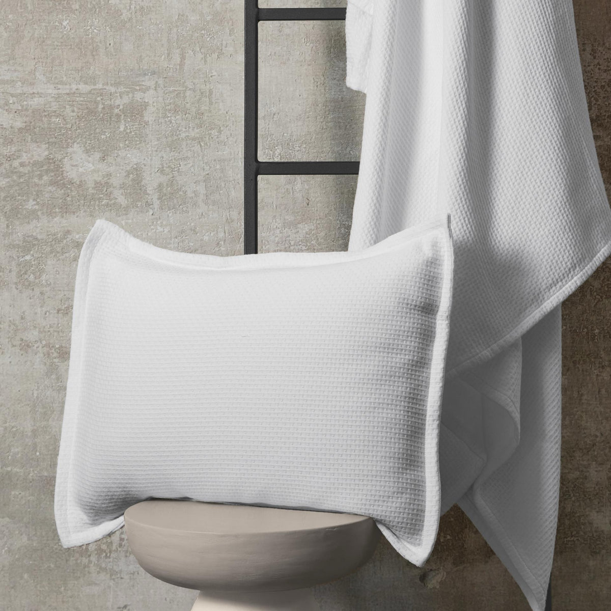 White BOVI PJ Pique Sham with its coverlet in the background