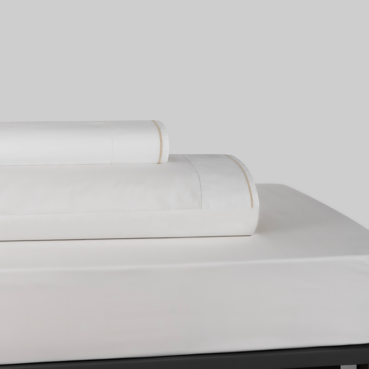 Stack of White and Latte BOVI Sierra Bedding Sheet Set