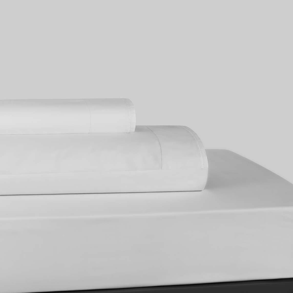 Stack of White and White BOVI Sierra Bedding Sheet Set