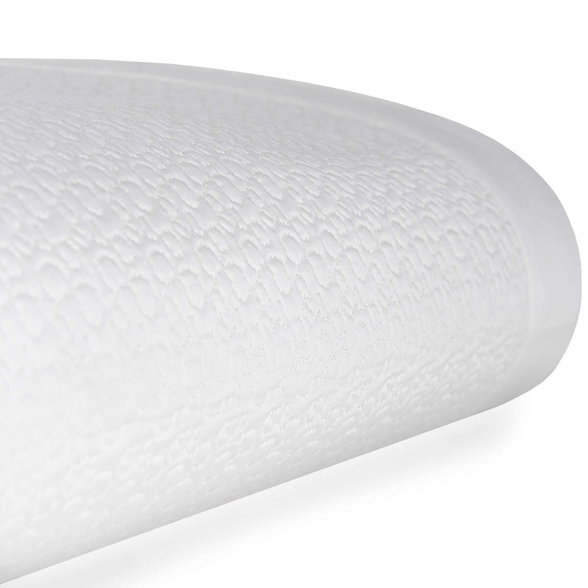 stack of BOVI Estella Coverlet in White and Latte, shown on a table