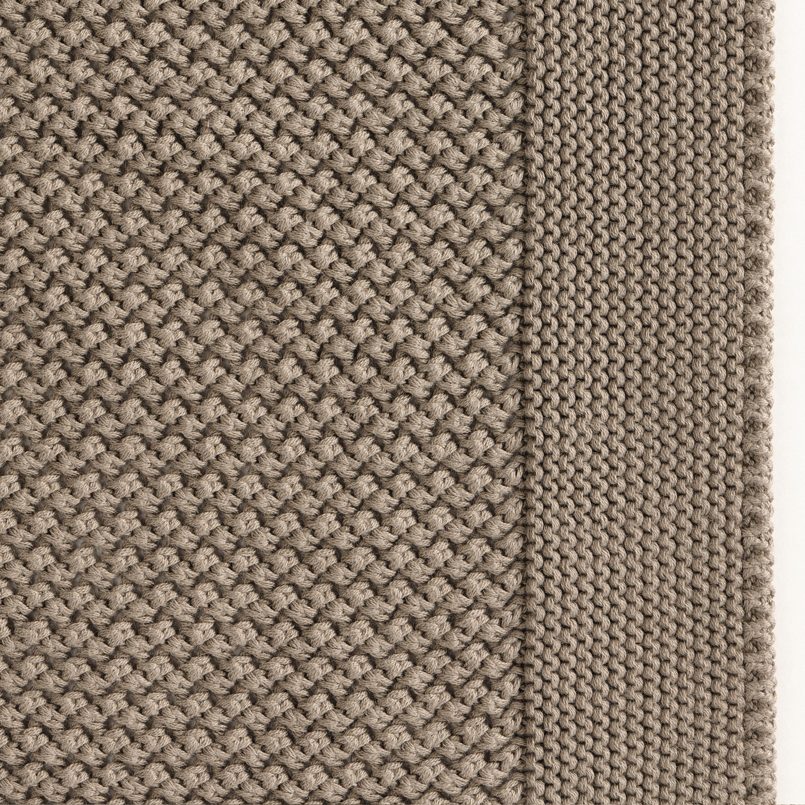 Celso de Lemos Balade Throw in Eucalyptus Color on a Bed