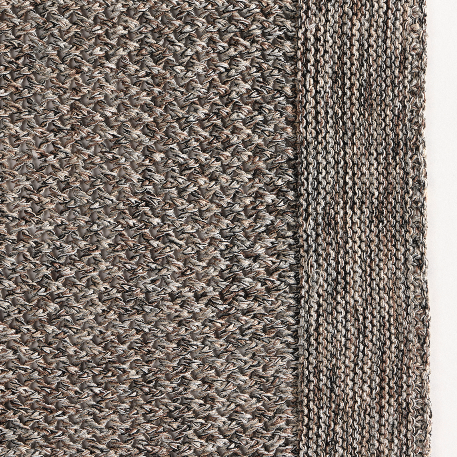 Celso de Lemos Balade Throw in Grey Linen Color on a Bed