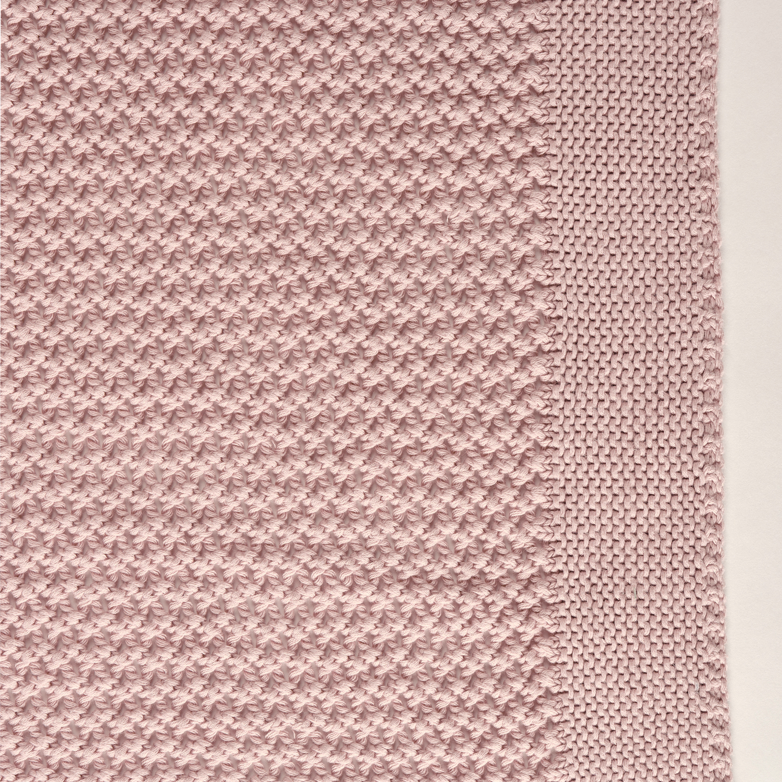 Celso de Lemos Balade Throw in Nuage Rose Color on a Bed