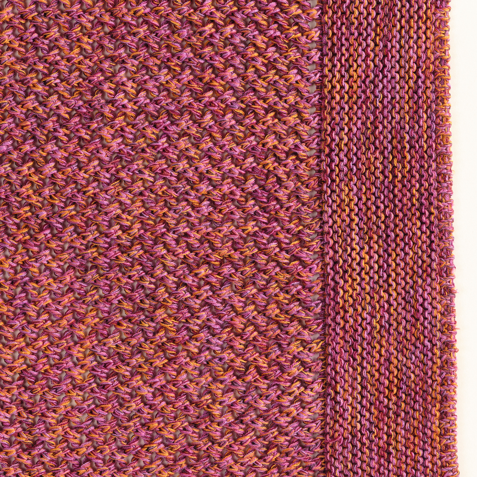 Celso de Lemos Balade Throw in Pink Orange Color on a Bed