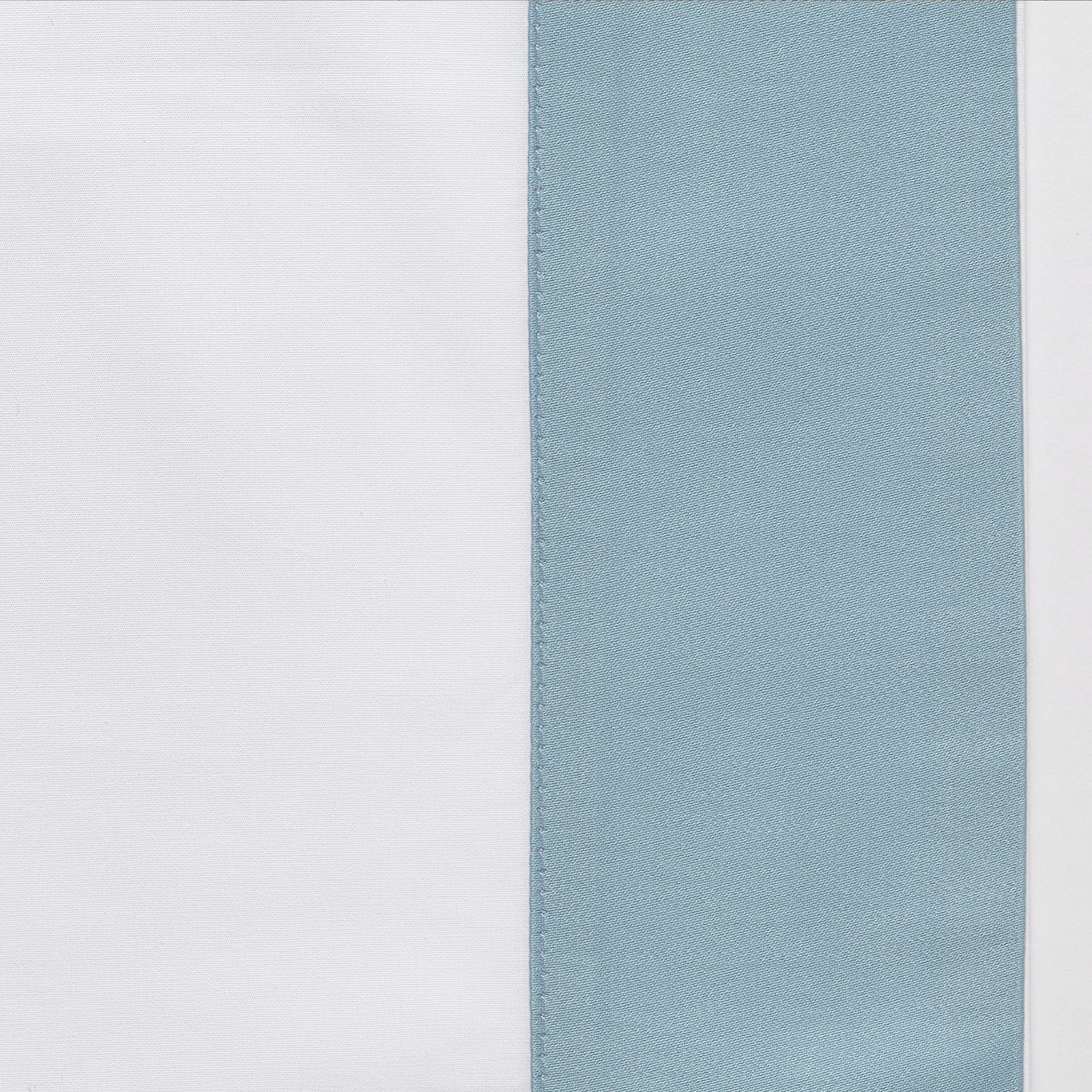 Full Bed Dressed in Celso de Lemos Hella Bedding with Atlantic Colored Swatch