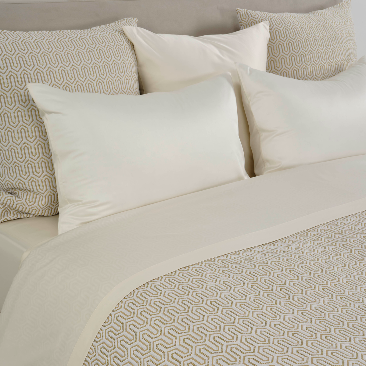 Closeup of Full Bed Dressed in Celso de Lemos Vendome Collection in Gold Color