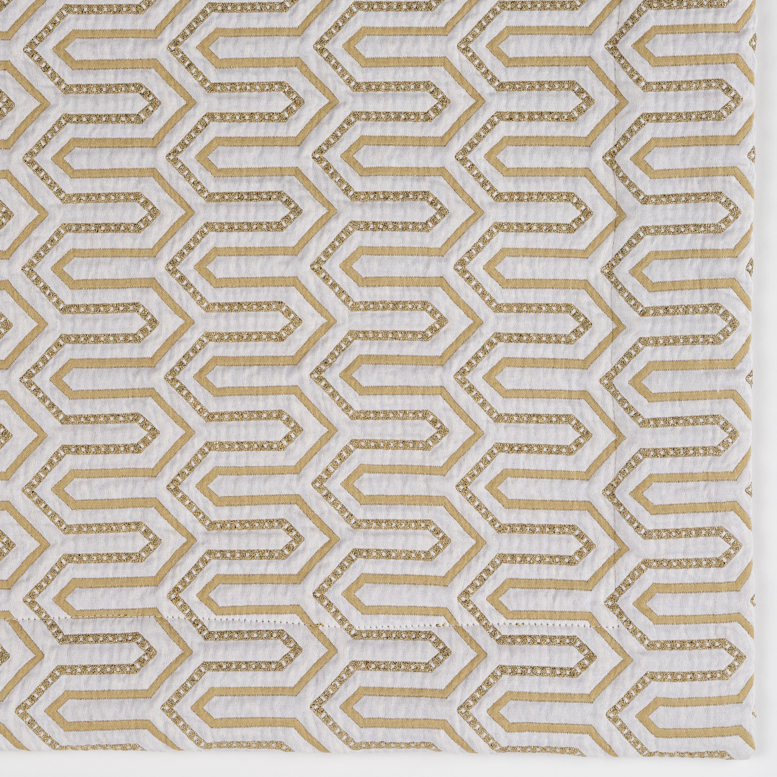 Lifestyle Shot of Pillow and Bed Cover of Celso de Lemos Vendome Collection in Gold Color