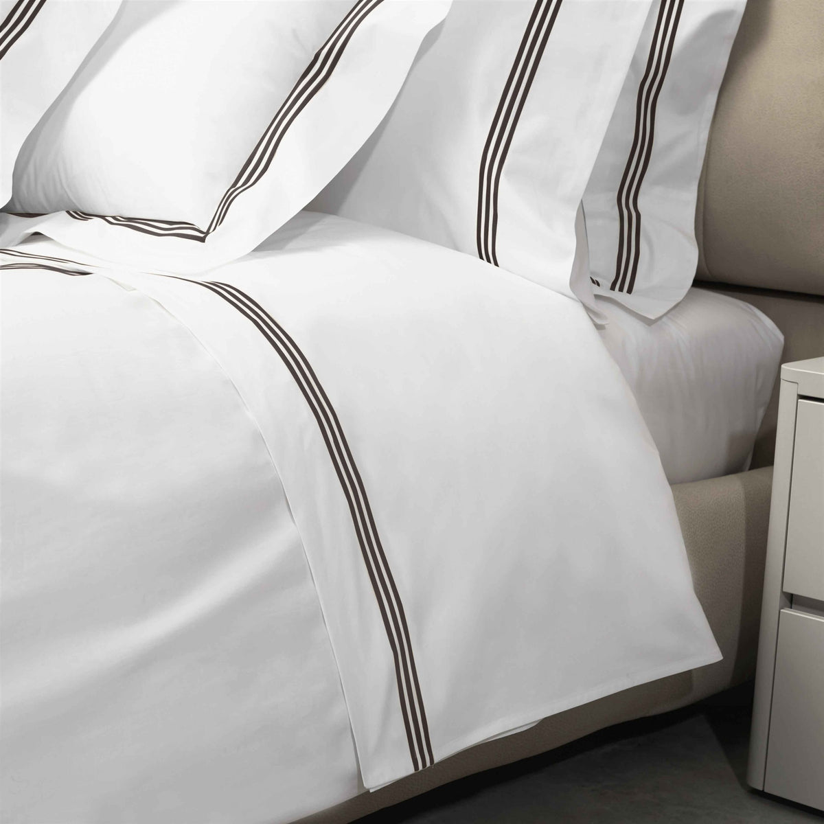 Closeup View of Signoria Platinum Percale Bedding in White/ESpresso Color