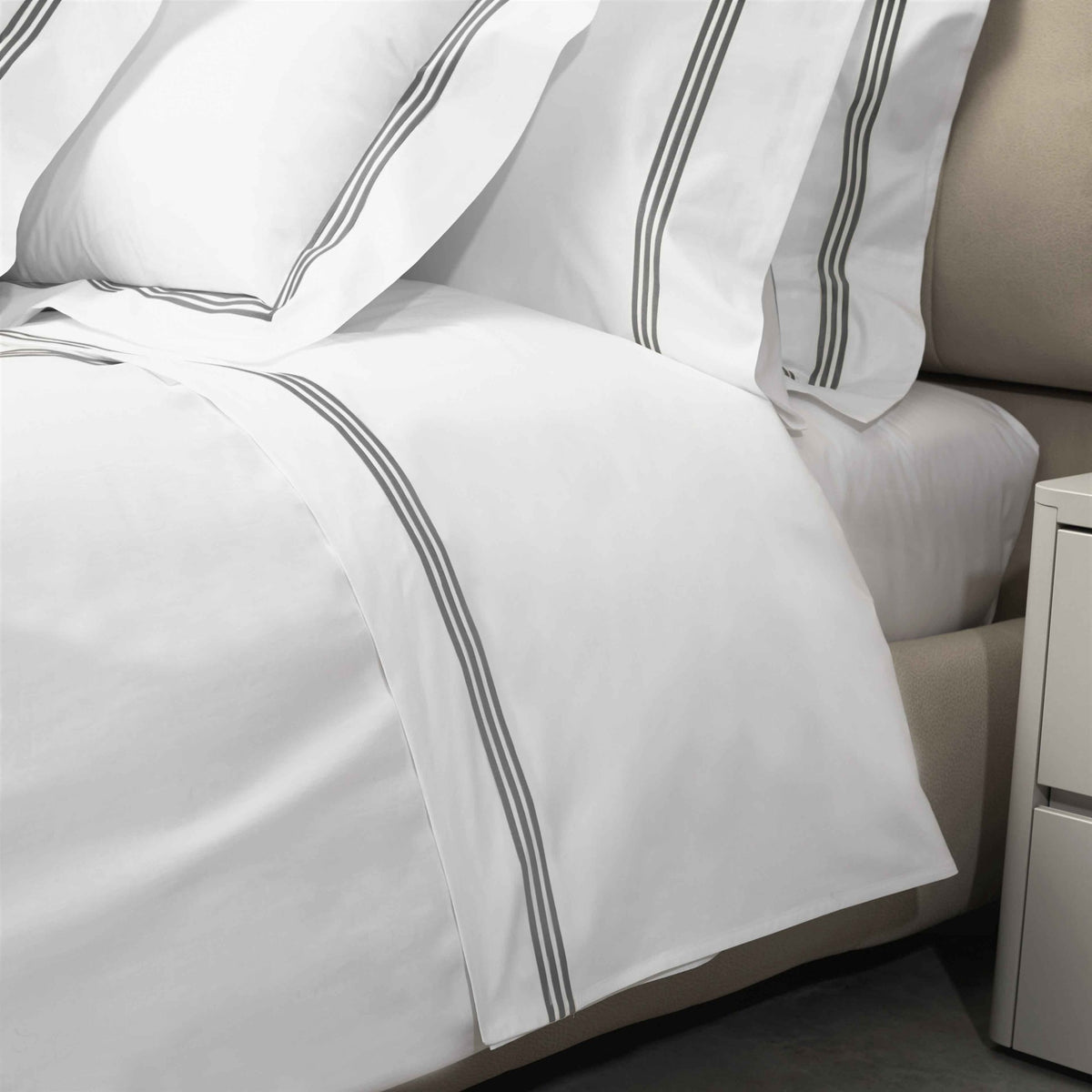 Closeup View of Signoria Platinum Percale Bedding in White/Lead Grey Color