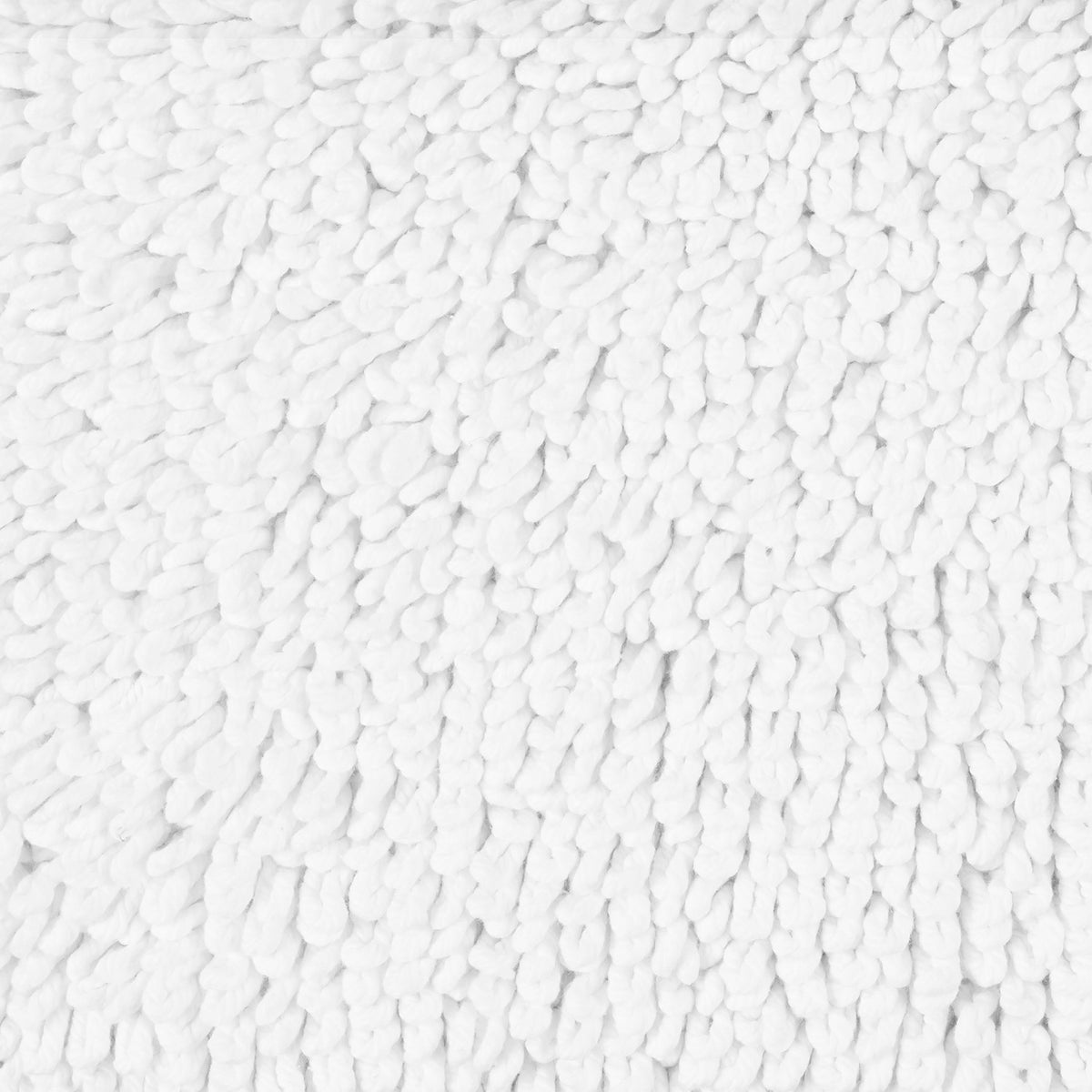 Close-up of a Matouk Costas Bath Rug, featuring soft, thick cotton fibers in a uniform, textured pattern.