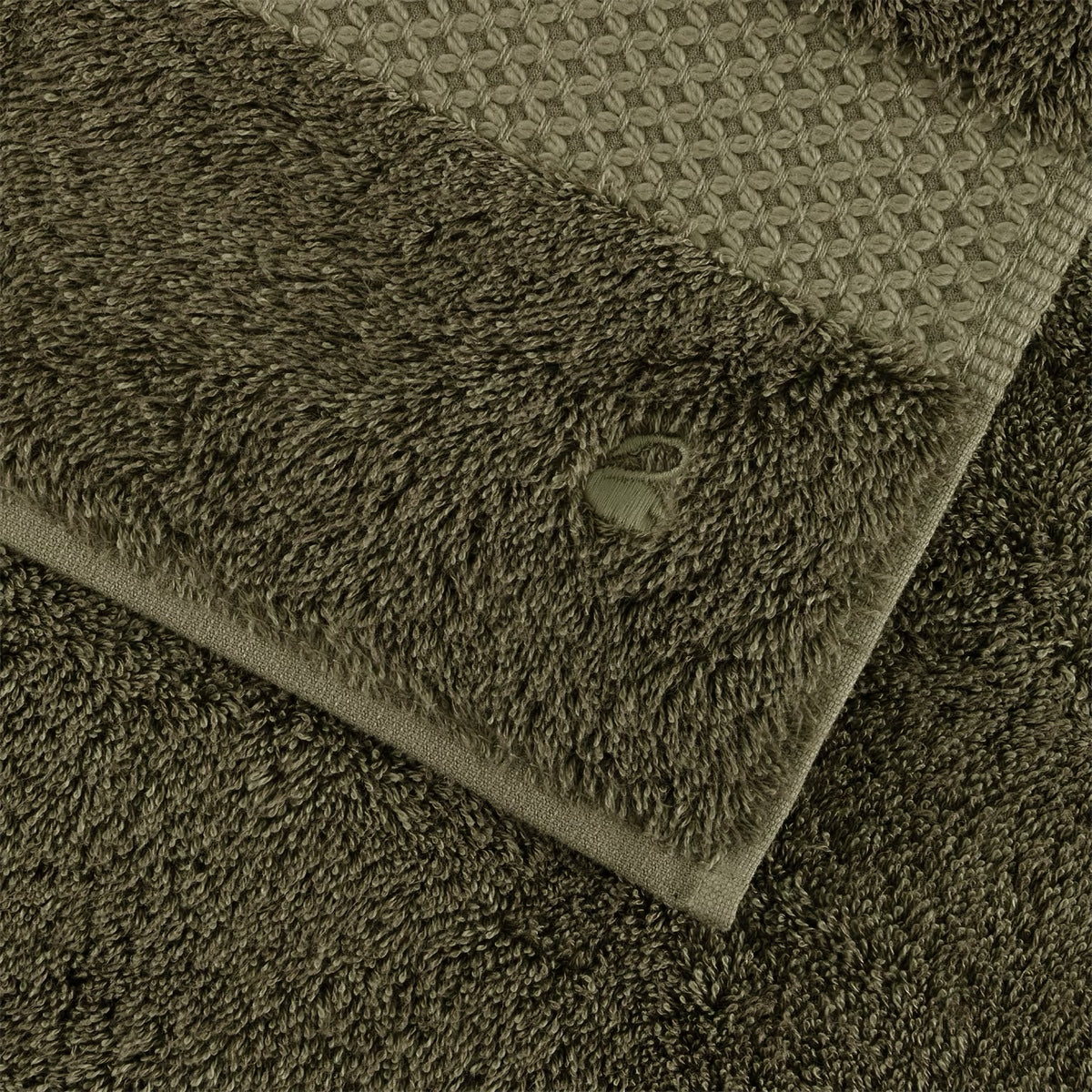 Fabric Closeup of Folded Yves Delorme Etoile Bath Towels in Kaki