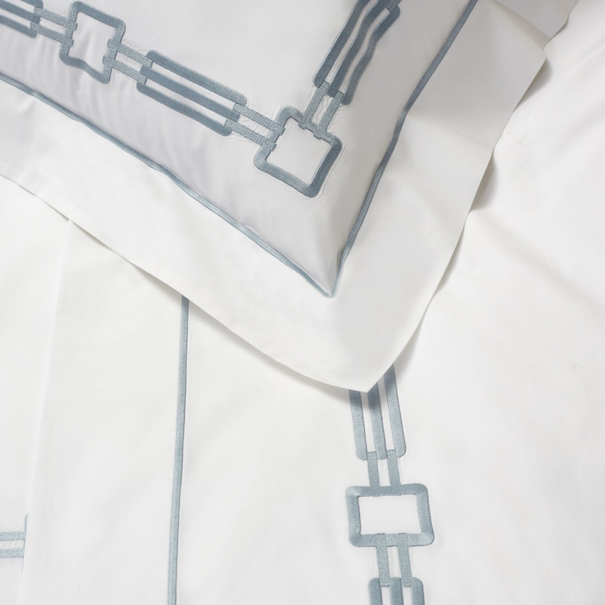 Detail of Retro Pillowcase and Flat Sheet in White/Wilton Blue Color