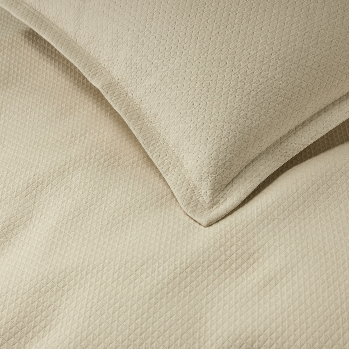 Clear Detail of Sferra Rombo Coverlet and Shams Sand