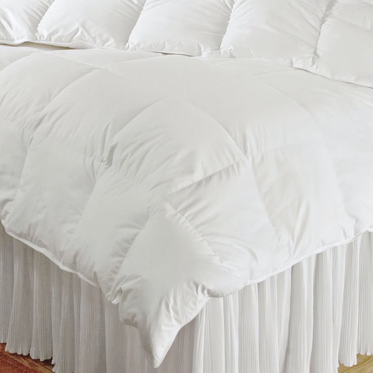 A white Downtown Company Alpine Loft Comforter on a bed