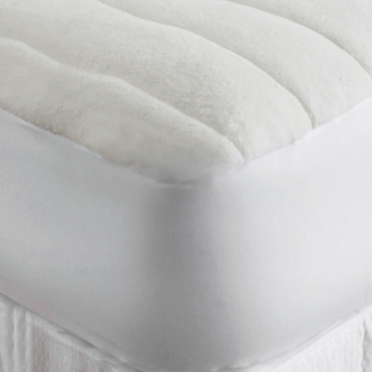 Closeup Image of Downtown Company Comfort Mattress Pad in Color Natural