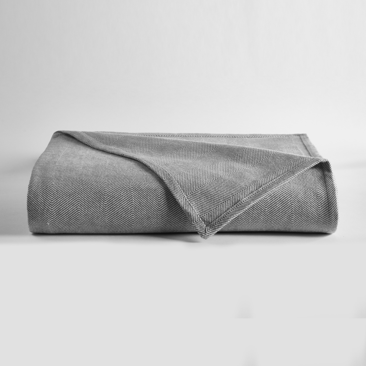 Clear Image of Downtown Company Herringbone Blanket Charcoal in Gray White Color