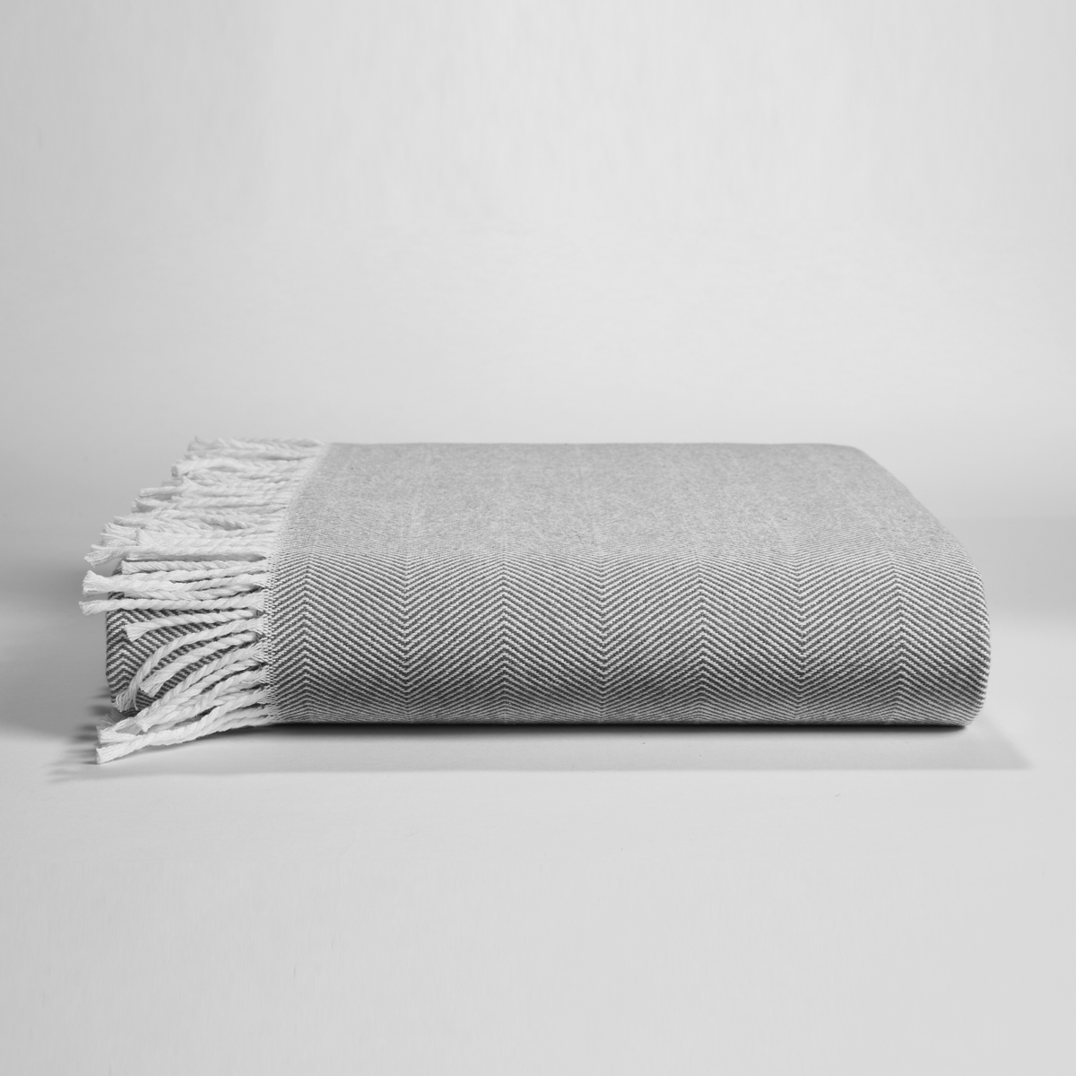 Clear Image of Downtown Company Herringbone Throw Charcoal in Gray White Color