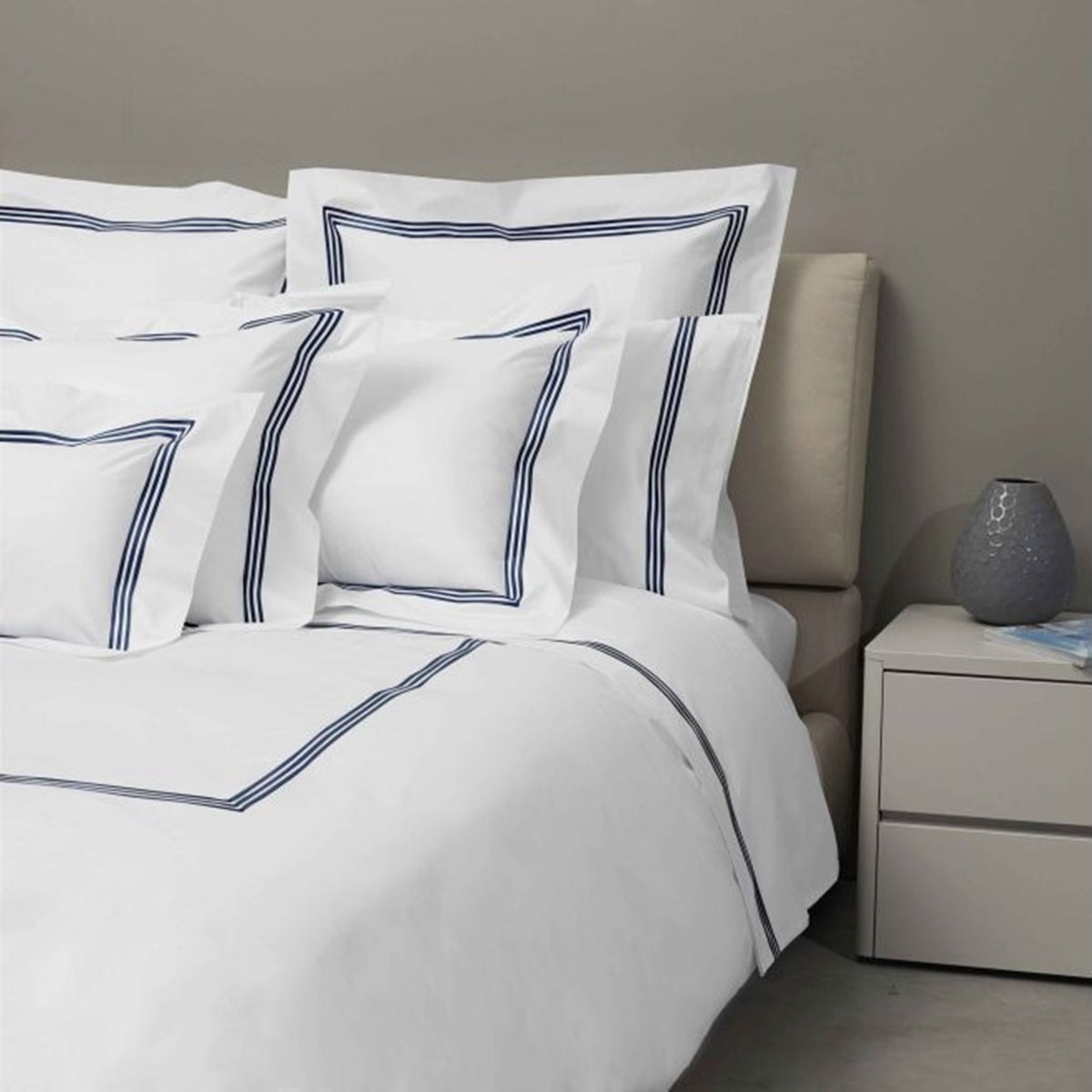 Bed Dressed in Signoria Platinum Percale Bedding in White/Dark Blue Color