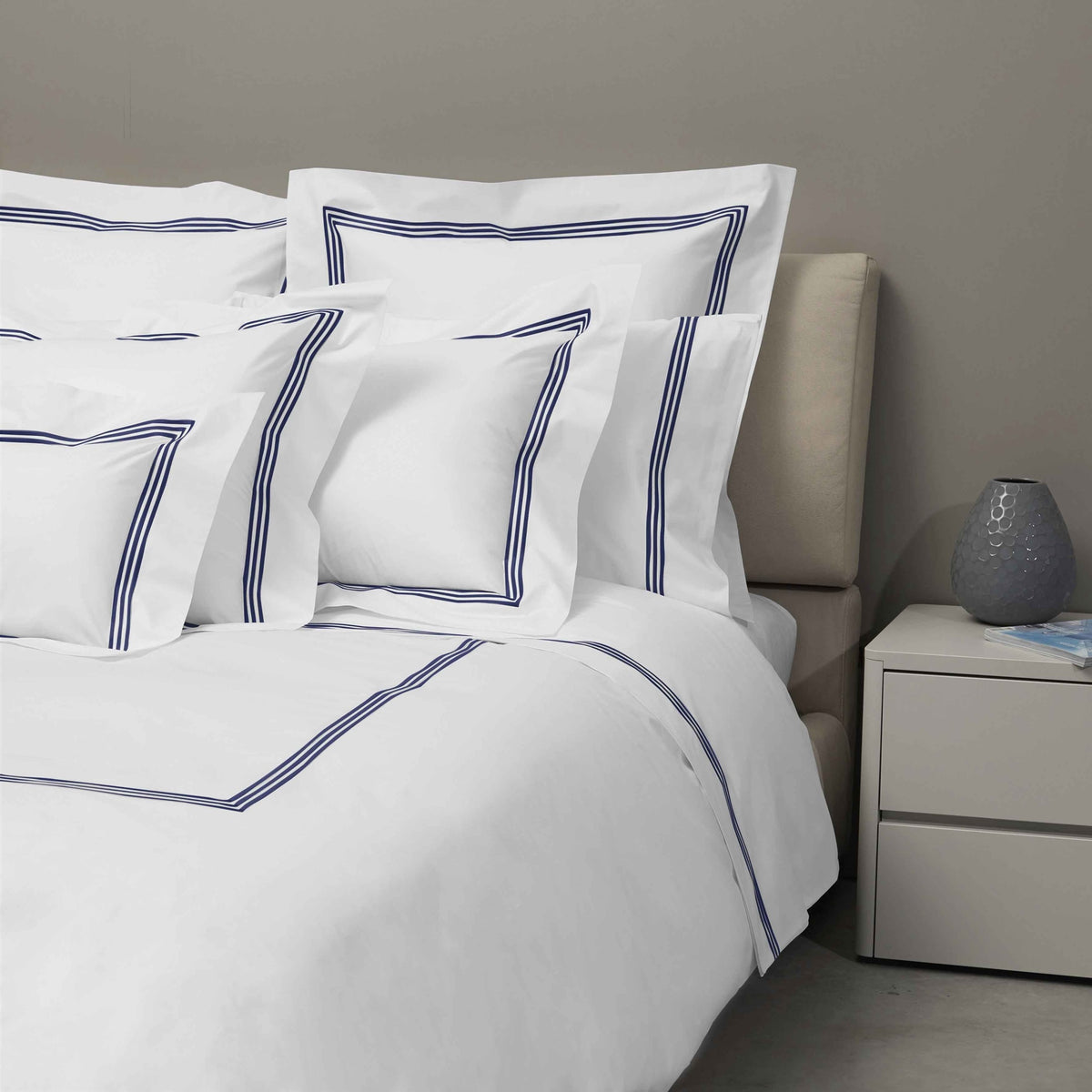 Bed Dressed in Signoria Platinum Percale Bedding in White/Midnight Blue Color