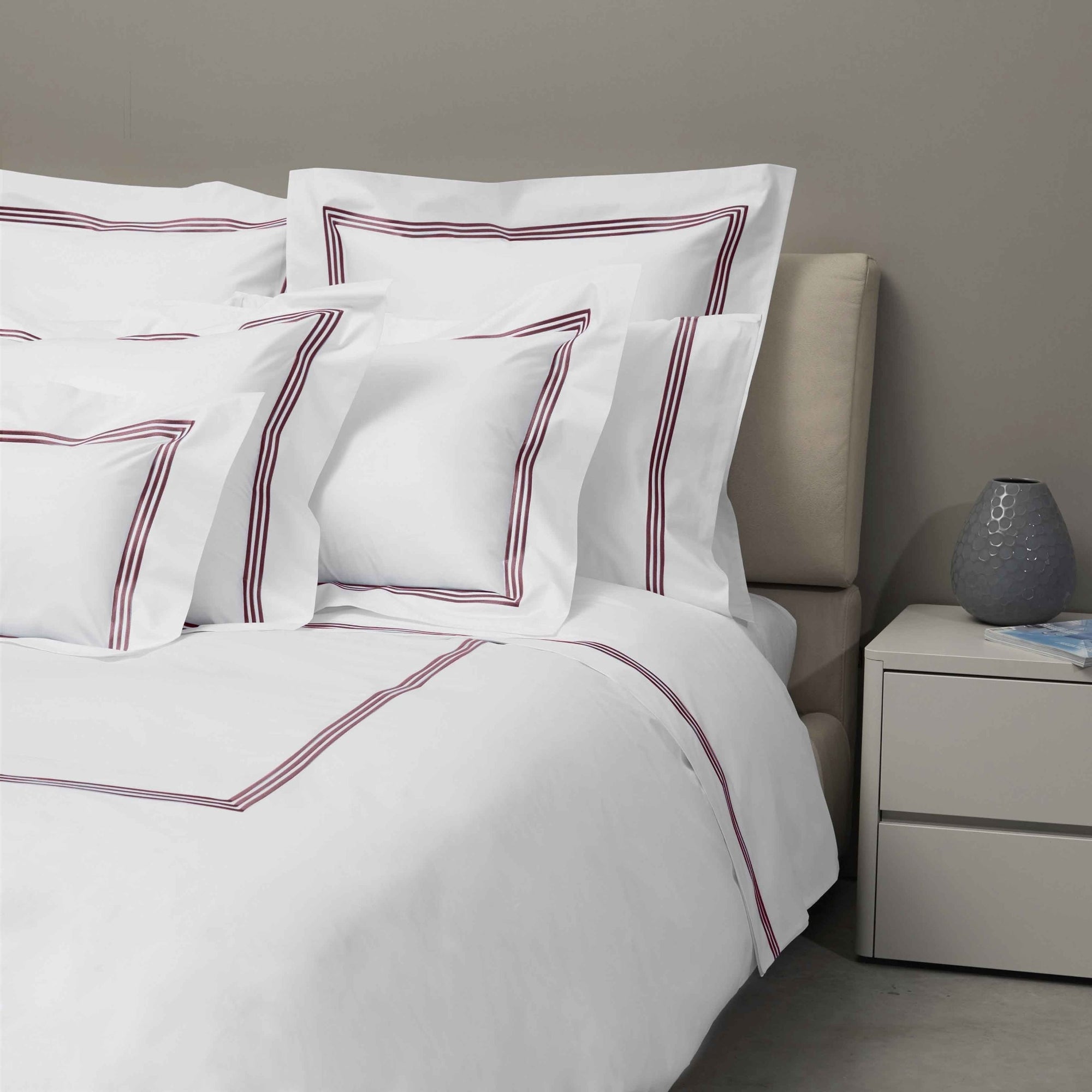 Bed Dressed in Signoria Platinum Percale Bedding in White/Plum Color