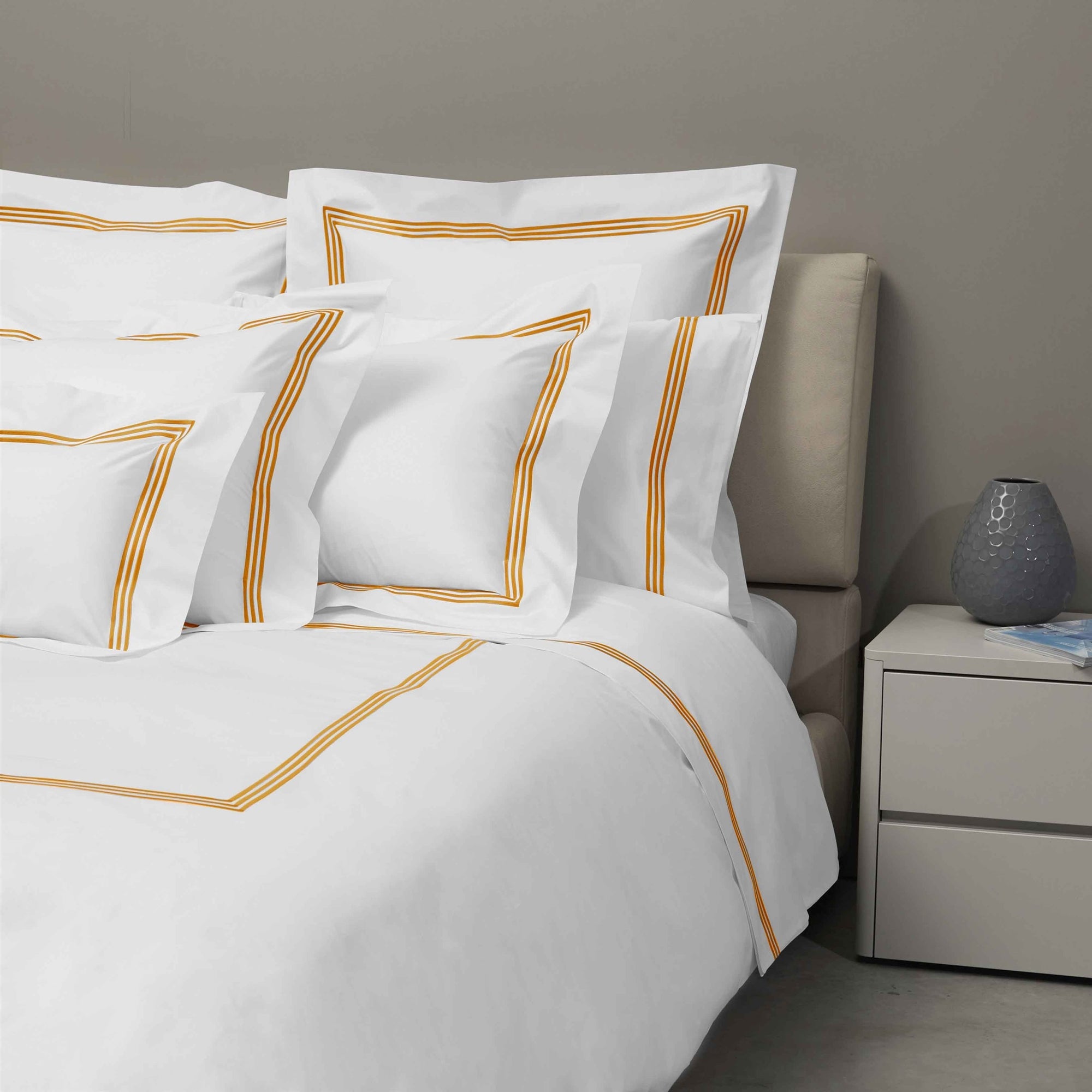 Bed Dressed in Signoria Platinum Percale Bedding in White/Rust Color