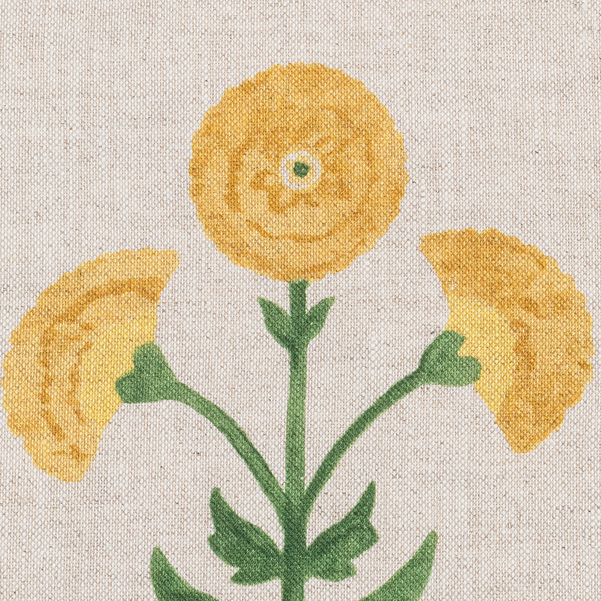 A fabric print of a yellow, round Gisele Marigold Natural flower with green stems on a beige background.