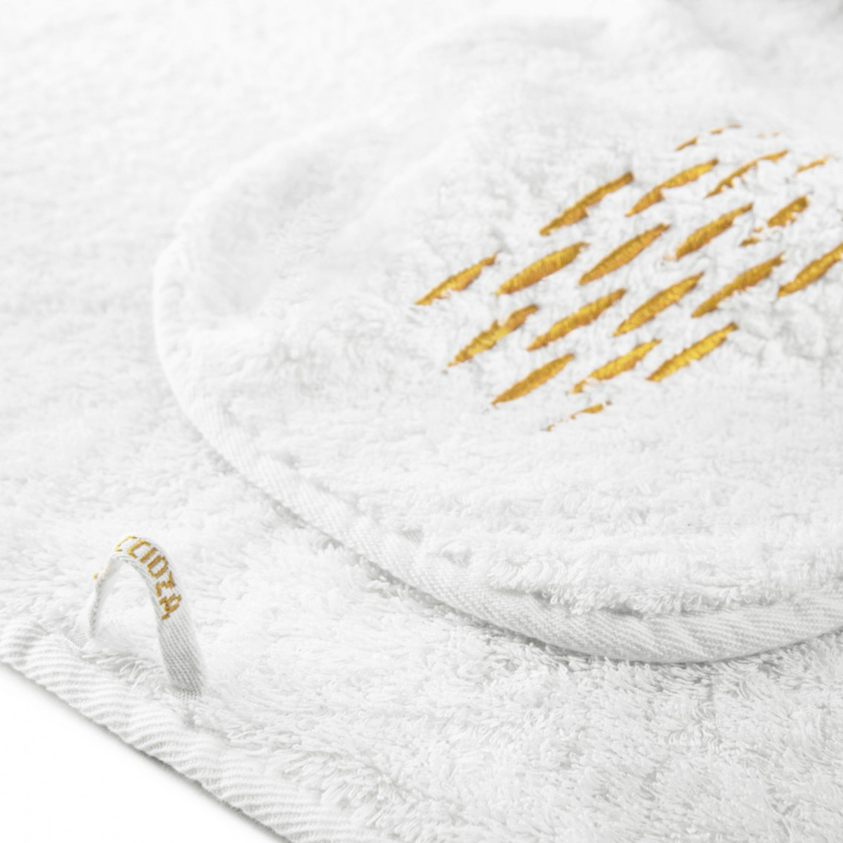 Graccioza Alhambra Bath Towel Closeup of White Gold Color and Hanging Loop