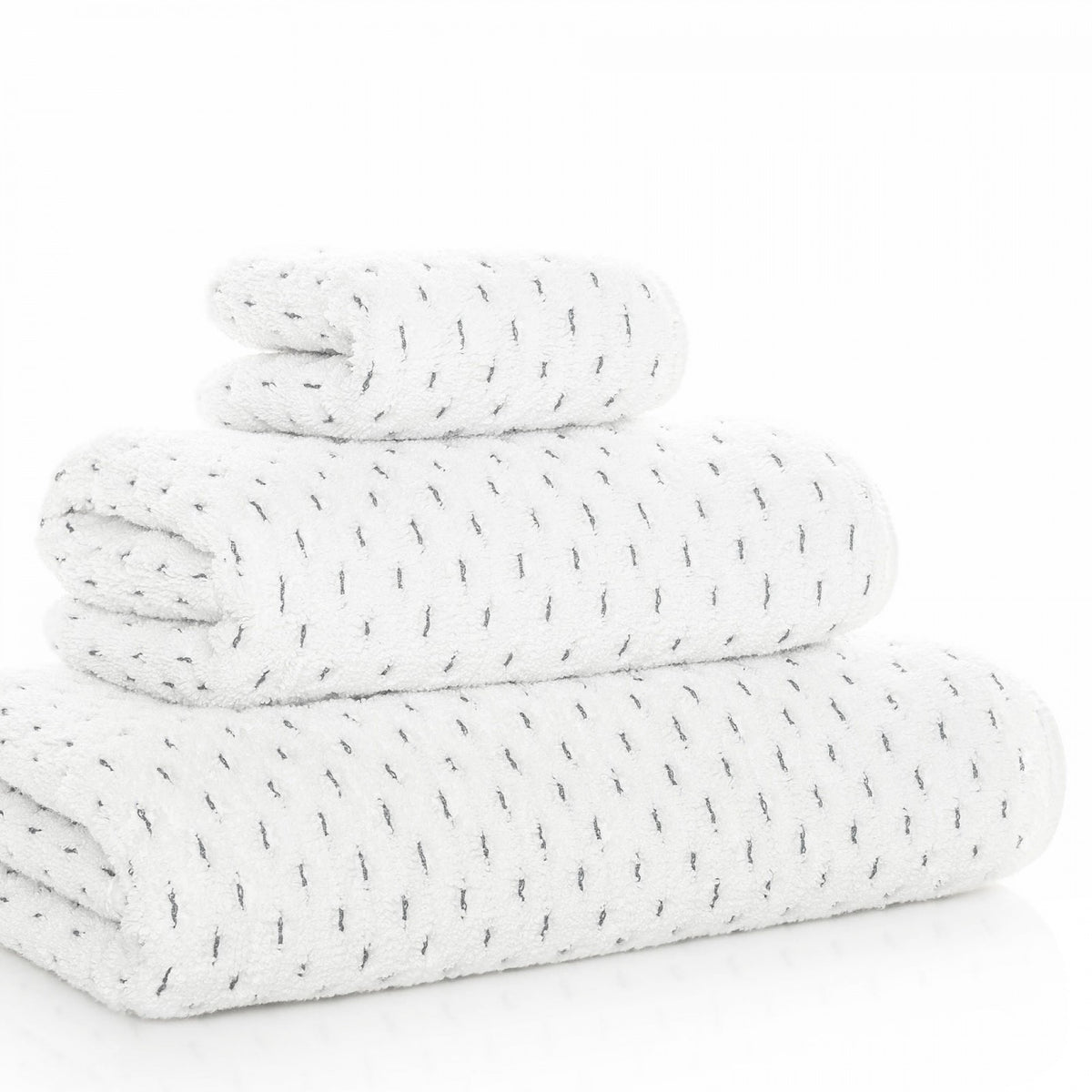 Stack of Graccioza Alice Bath Towel in White and Storm colors at an angle