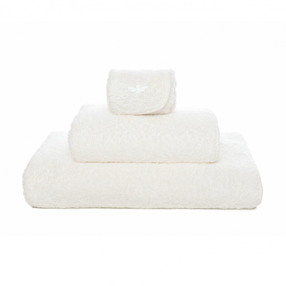 Stack of Graccioza Apiary Bath Towels Snow Color
