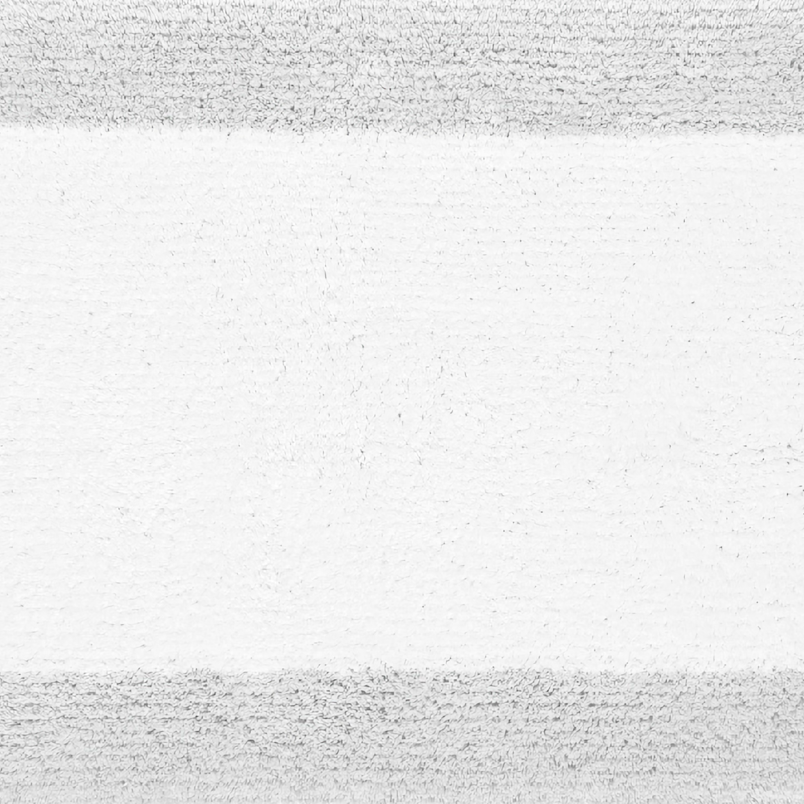 Stack of Graccioza Bicolore Bath Towels and Rug in Cloud and White