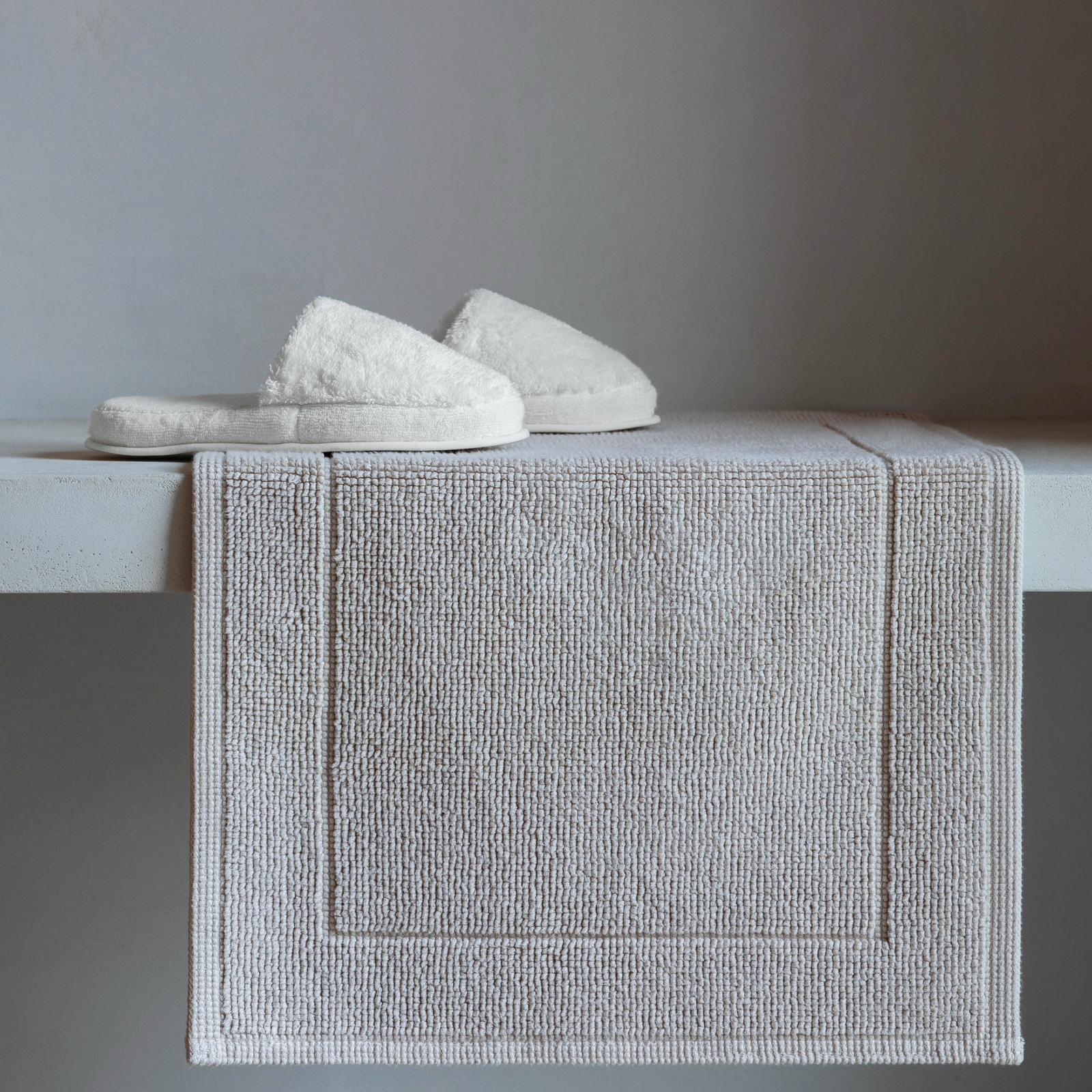 Graccioza Egoist Slippers on Bath Rug