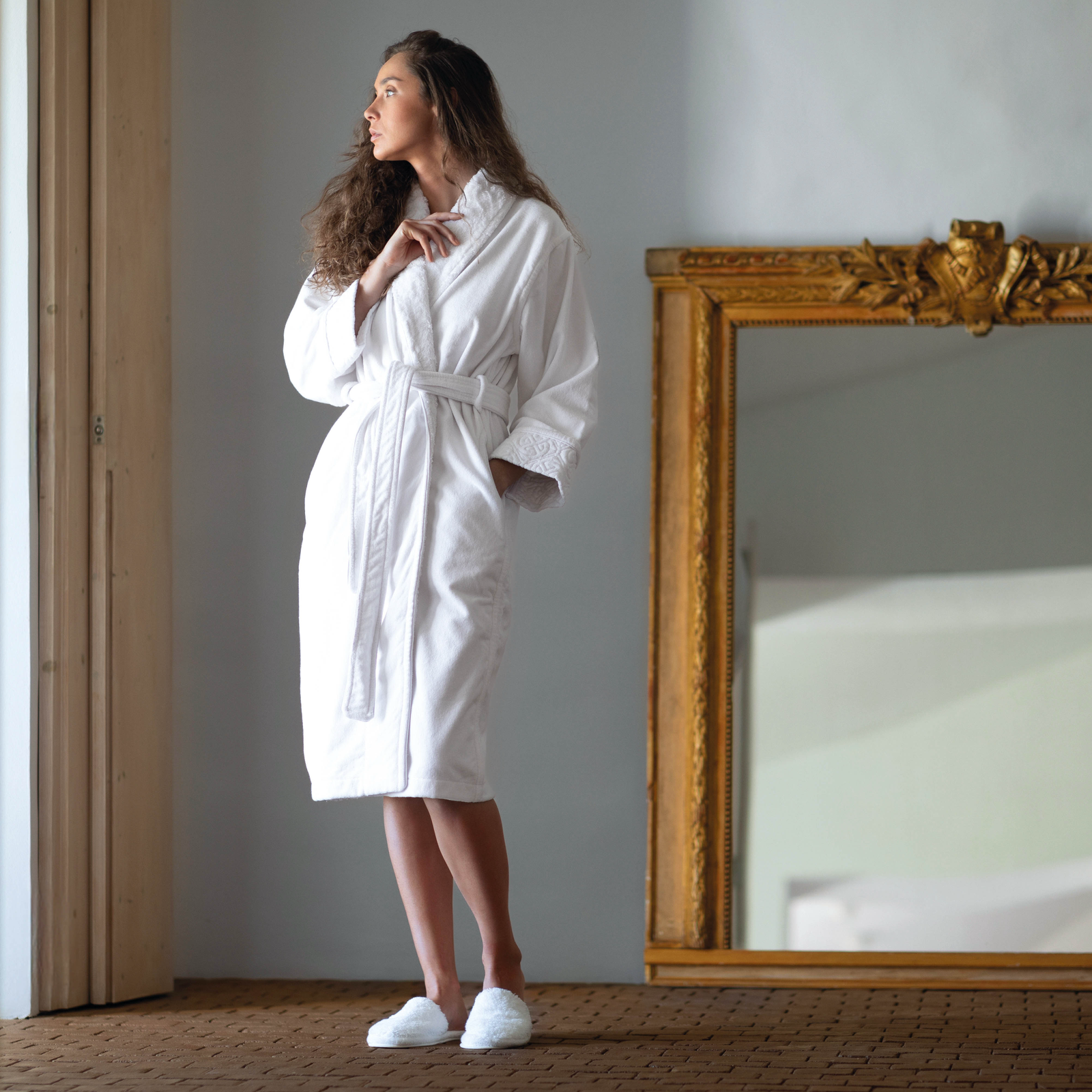 Woman Wearing a Graccioza Grand Egoist Bath Robe in White