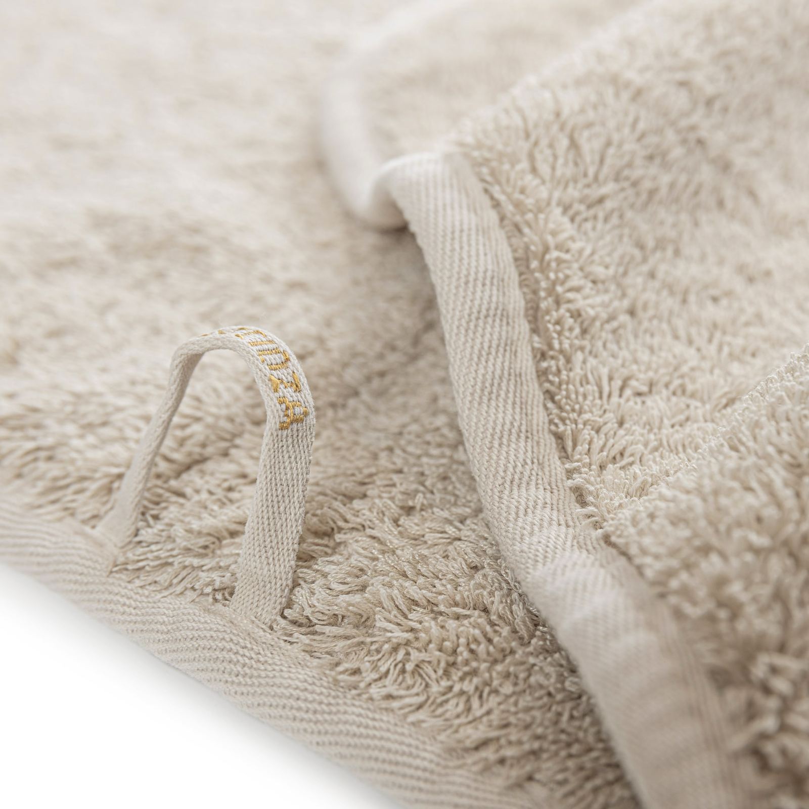 Stack of Graccioza Tecnic Bath Towels in Fog