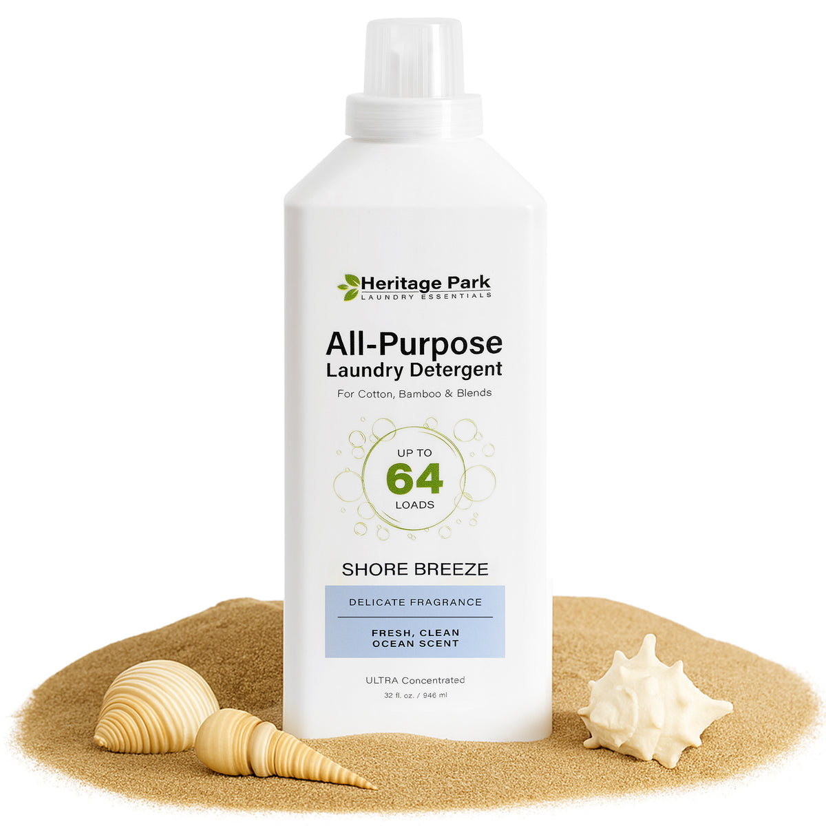 32oz bottle of Shore Breeze scent Heritage Park Luxury All Purpose Laundry Detergent with sand and shells in background