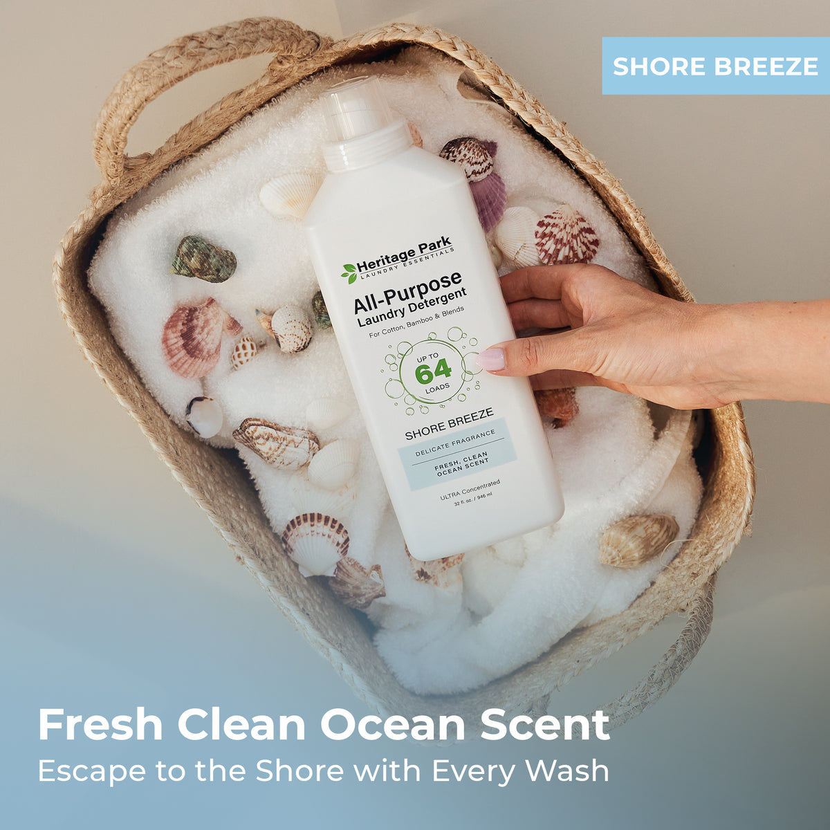 Hand holding a bottle of Heritage Park All-Purpose Shore Breeze Laundry Detergent in a woven basket with text highlighting its fragrance