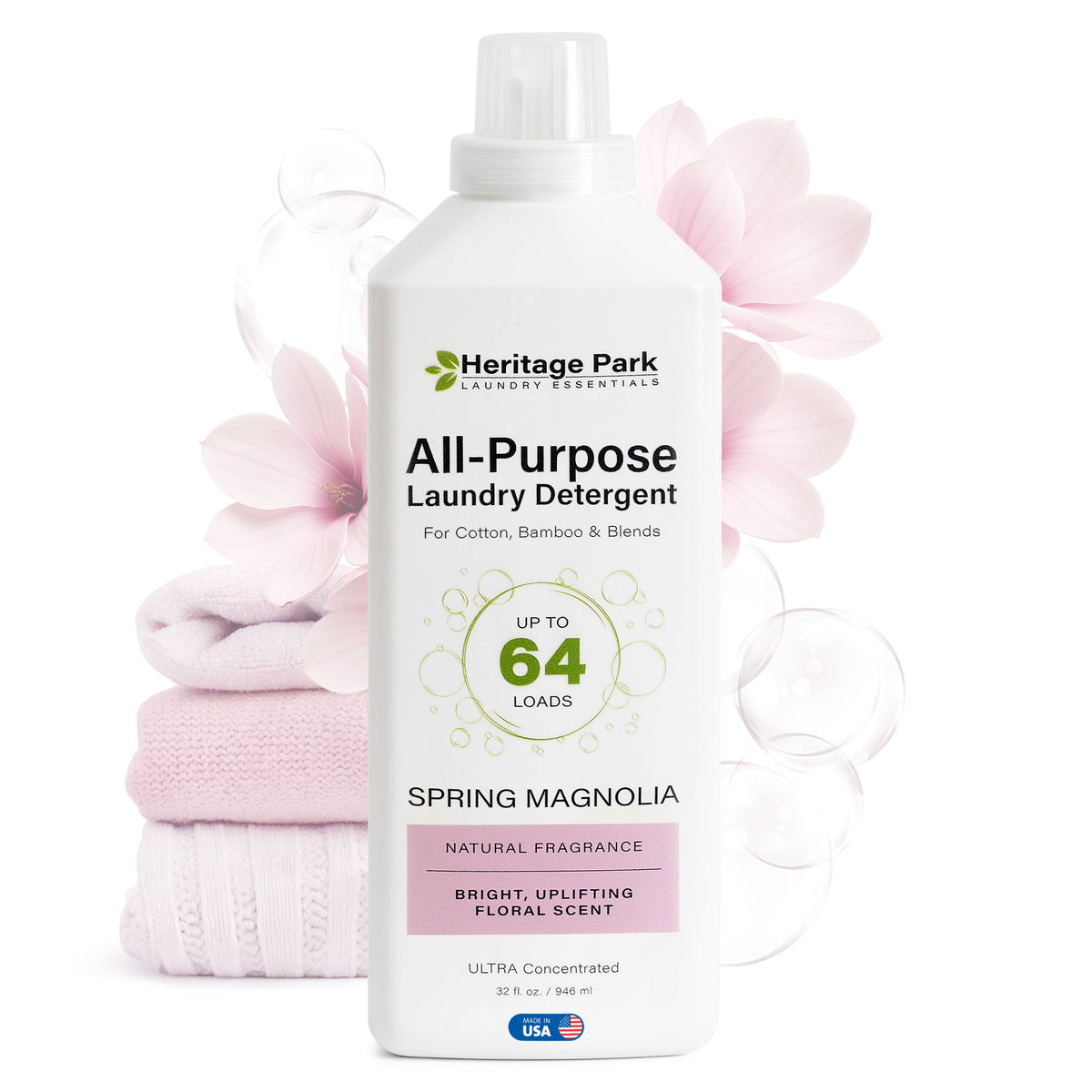 32oz bottle of Spring Magnolia scent Heritage Park Luxury All Purpose Laundry Detergent with flowers in background