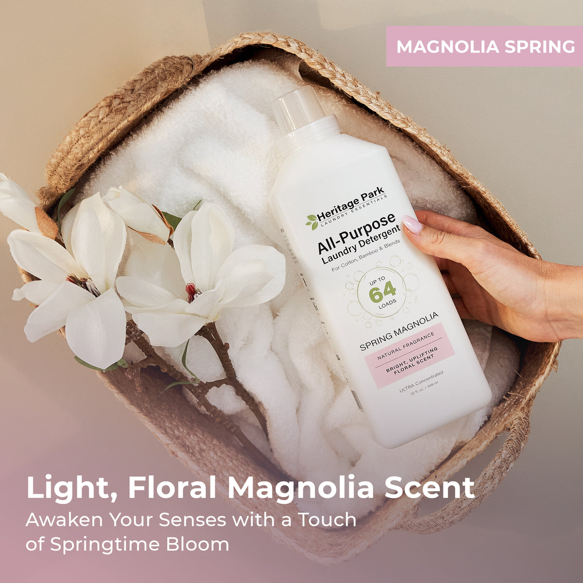 Hand holding a bottle of Heritage Park All-Purpose Spring Magnolia Laundry Detergent in a woven basket with text highlighting its fragrance