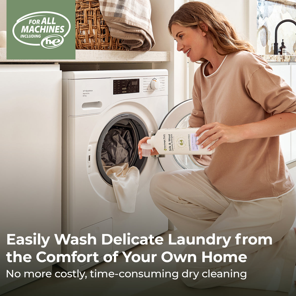 Woman in a laundry room with a washing machine, holding a Heritage Park Silk and Wool Fragrance Free 32oz bottle