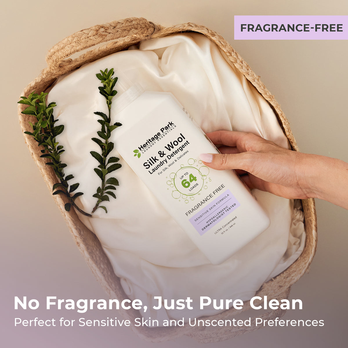 Hand holding a bottle of Heritage Park Silk and Wool Fragrance Free Laundry Detergent in a woven basket with text highlighting its unscented properties