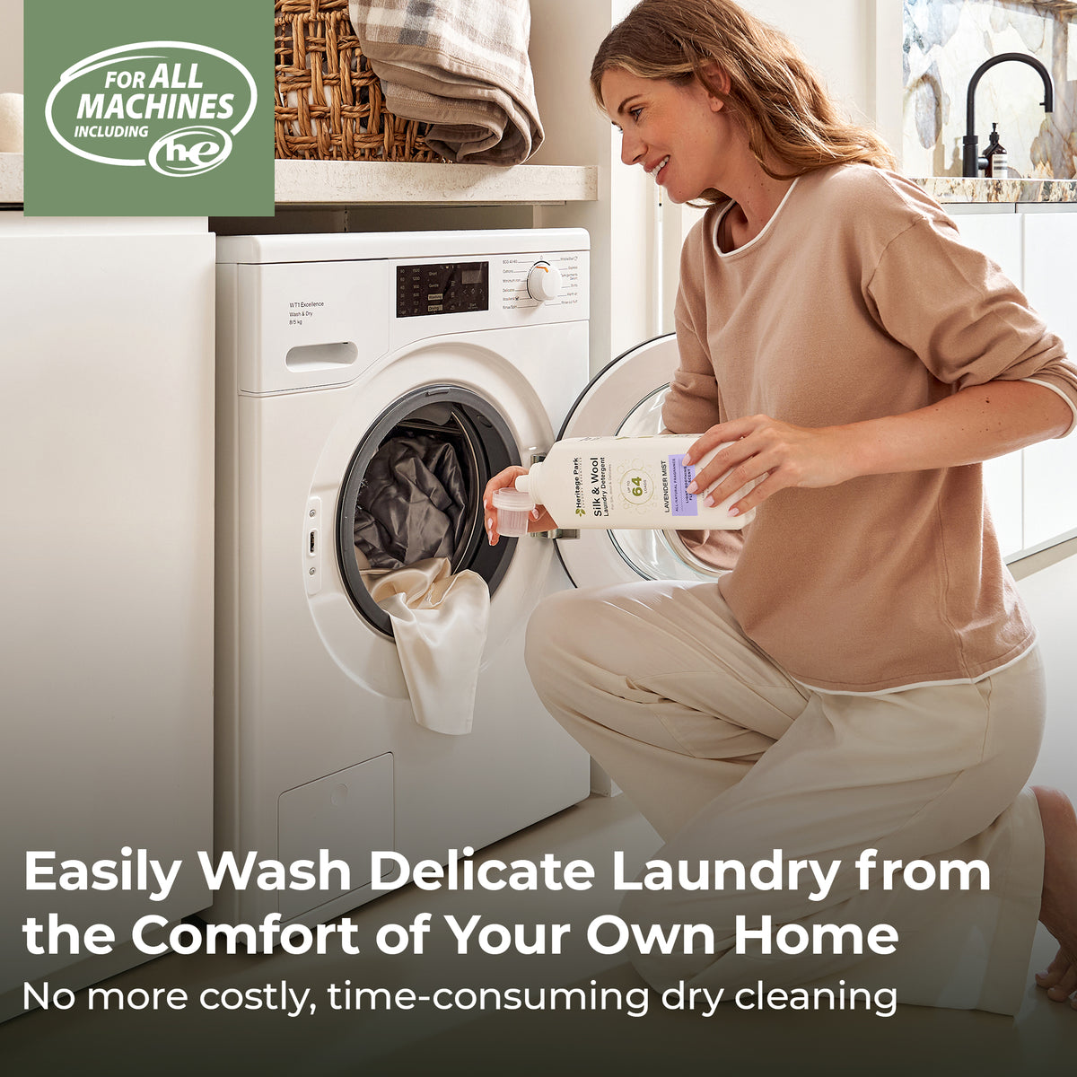 Woman in a laundry room with a washing machine, holding a Heritage Park Silk and Wool Lavender Mist 32oz bottle