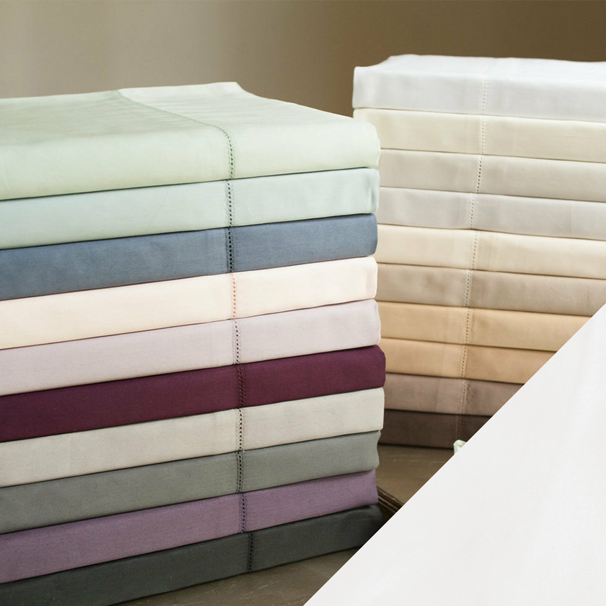 Stack of Home Treasures Royal Sateen Bedding with Natural White Color Swatch