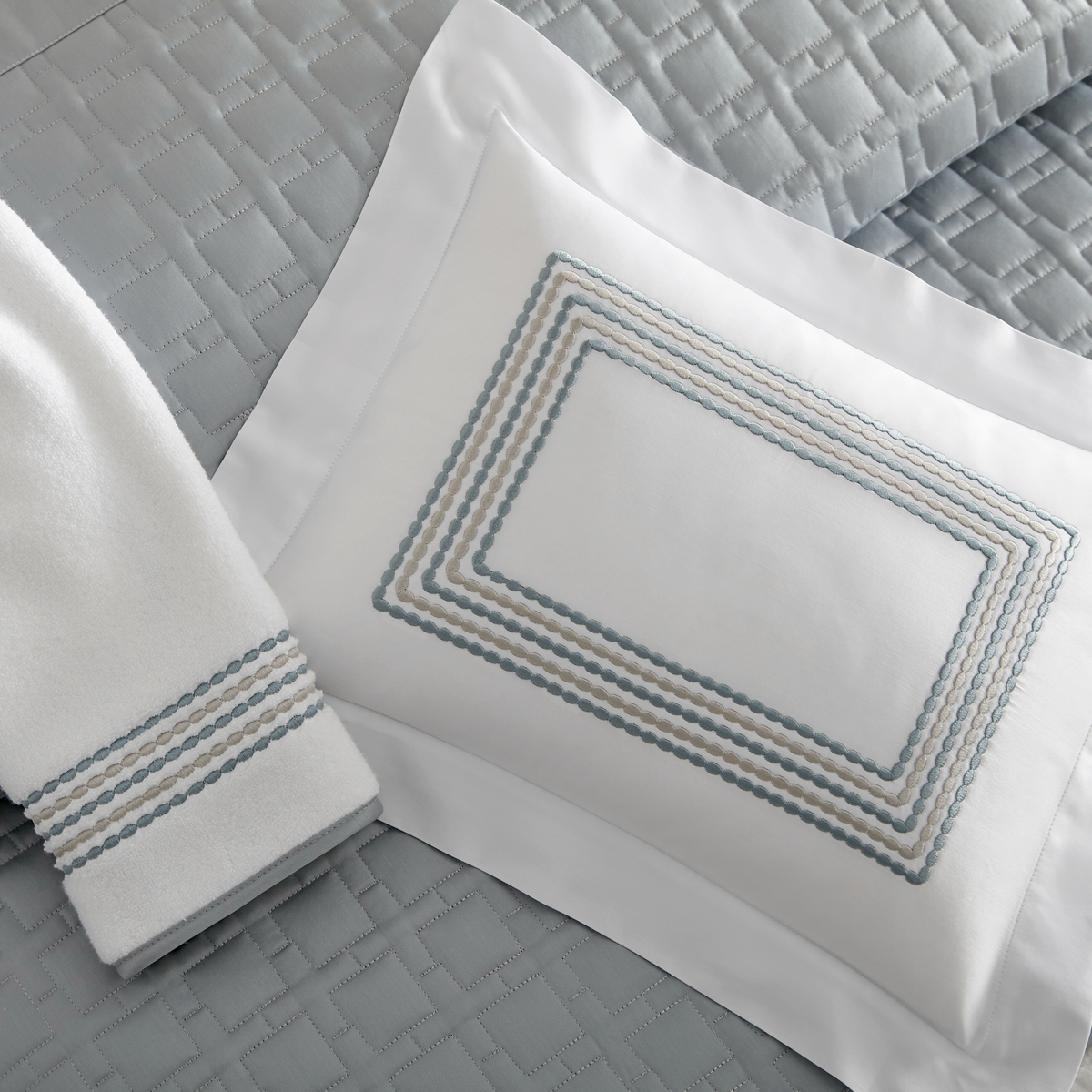 Closeup view of Home Treasures Stella Bedding in Sky Blue color embroidery