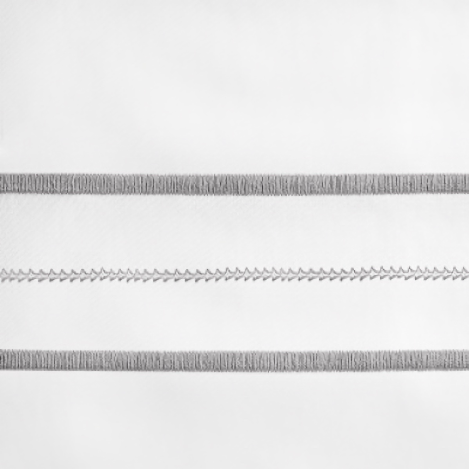 Lifestyle Image of Home Treasures Triad Bedding with White/Chrome Swatch